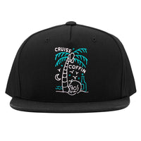 Line drawing tropical scene with skull whiskey moon and palm tree on a Cruise Coffin snapback hat.
